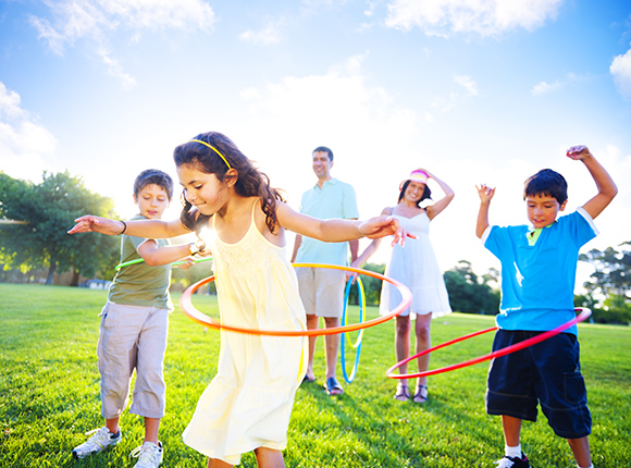 Carefree family playing because they're covered by insurance