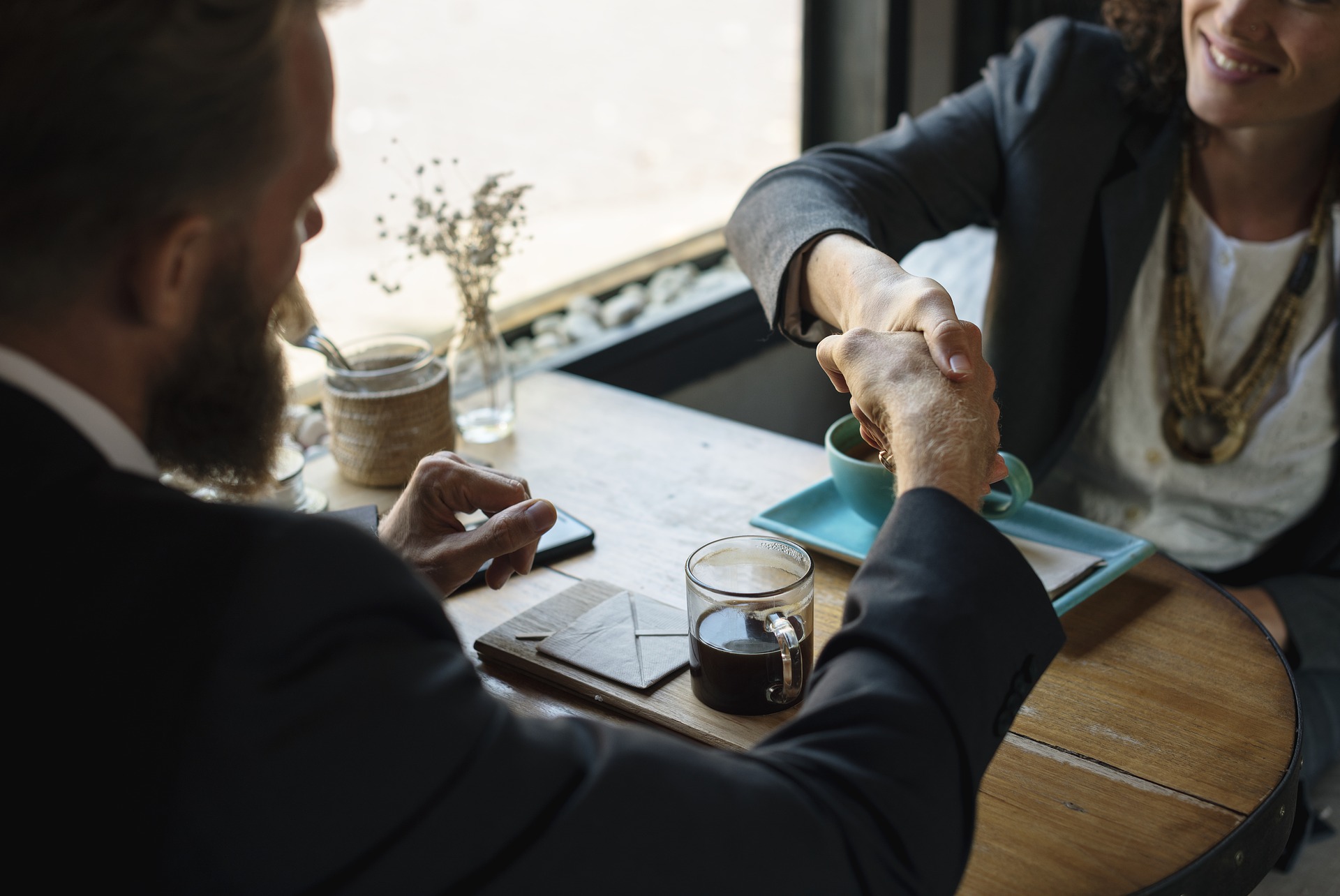 Agreeing to business insurance policy in cafe